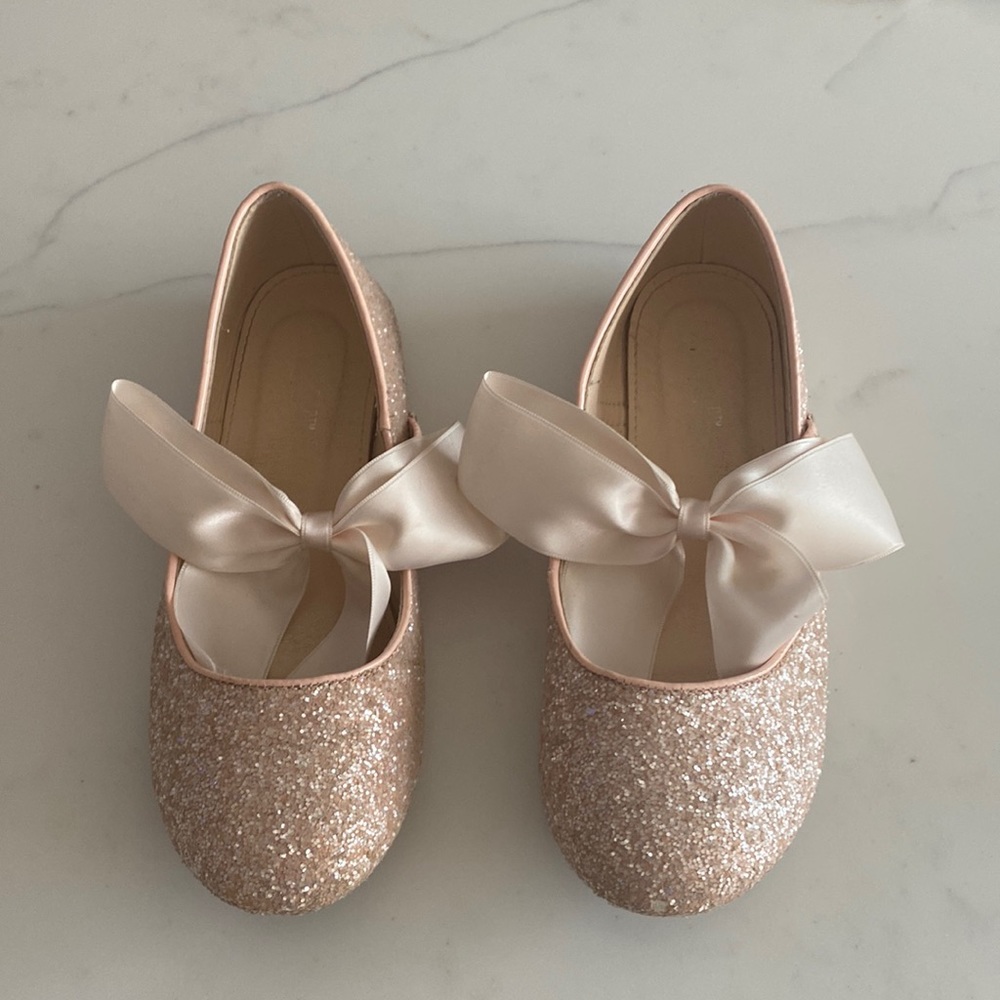 Pink sparkly girls ballet shoe flats with big satin fixed bows.